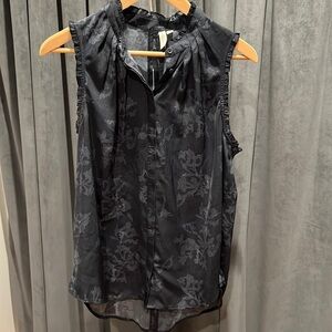 Sleeveless button down top with ruffles